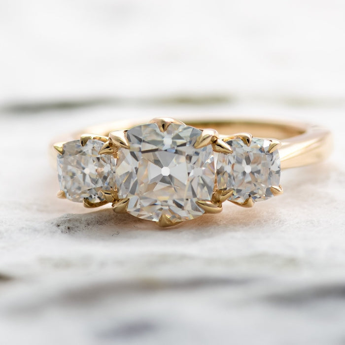 OMC moissanite three stone ring